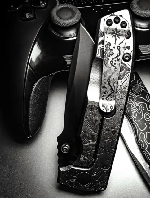 Engraved black folder resting against a game controller