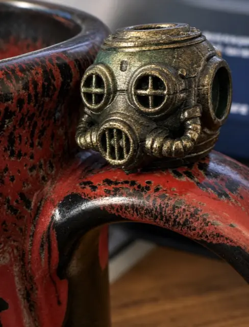 Brass diving helmet bead on a red engine fin