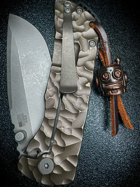 Sculpted white blade with matching skull bead