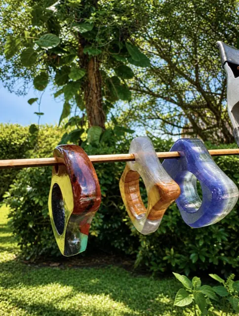 Resin knucks hanging in a row outdoors