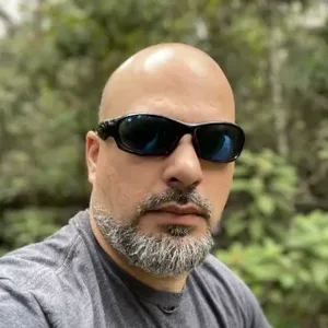 Danny, itisntdan, in sunglasses out in the woods